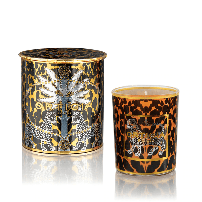 Decorated glass candle jar of amber wax, rich with musky amber and spice perfume.