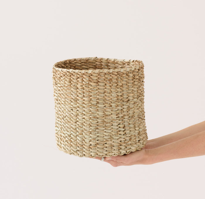 Hand held woven Talala Basket against white background