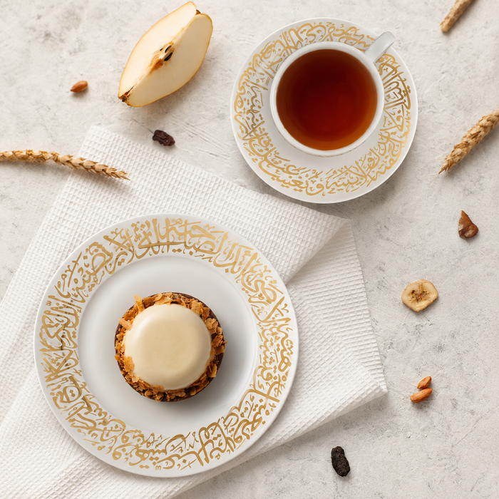 Dimlaj Kareem large serving plate in 22K gold-gilded glass, styled in a room setting