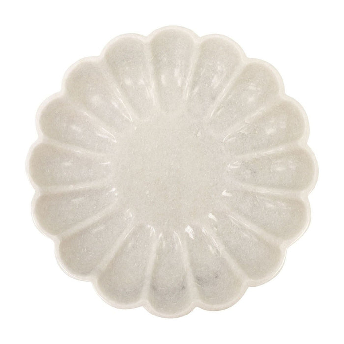 White marble plate with a textured, flower-like design on a white background