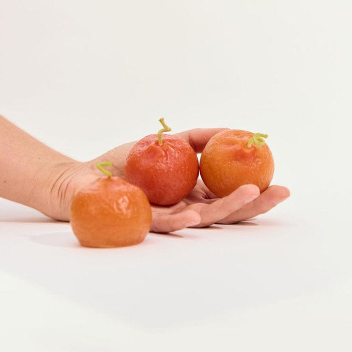 orange-beeswax-candle-held_Little-and-Fox
