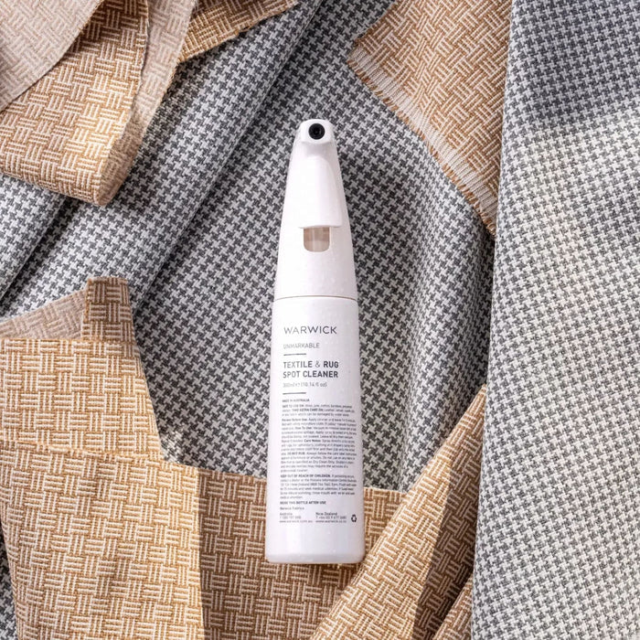 Textile and rug spot cleaner bottle on fabric background