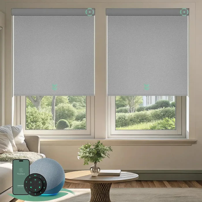 Motorized blackout roller shades with vinyl-light grey fabric, delivering full light blockage and enhanced privacy